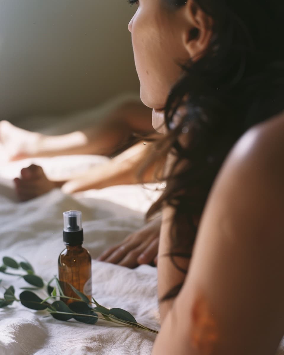 Glass skincare bottles on linen at golden hour